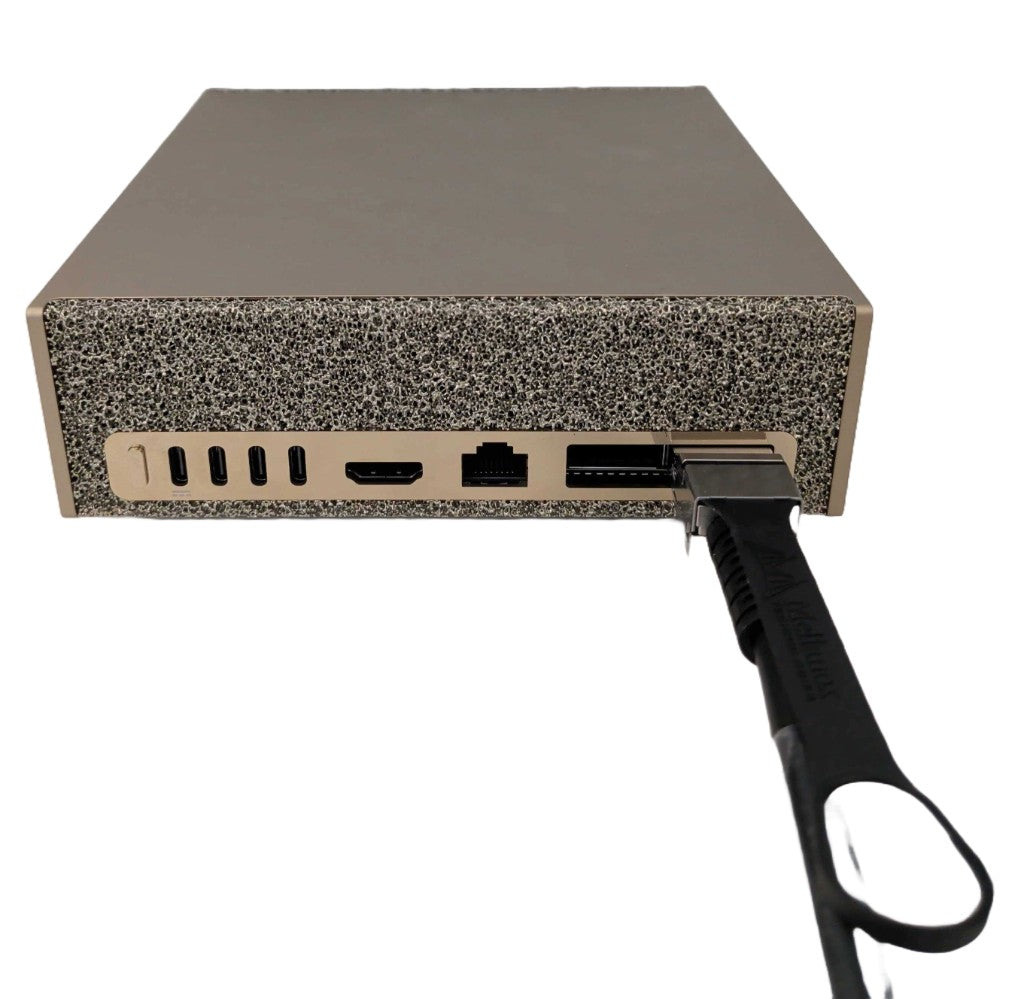 QSFP112 cable fitted to a DGX Spark ConnectX-7 port with its pull tab facing up