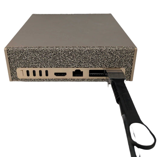 QSFP112 cable fitted to a DGX Spark ConnectX-7 port with its pull tab facing up